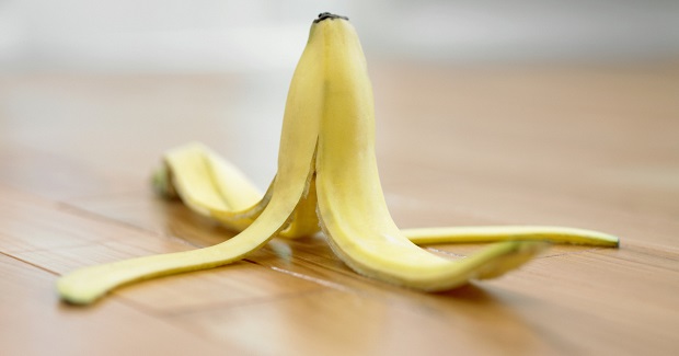 Banana peel on wooden floor